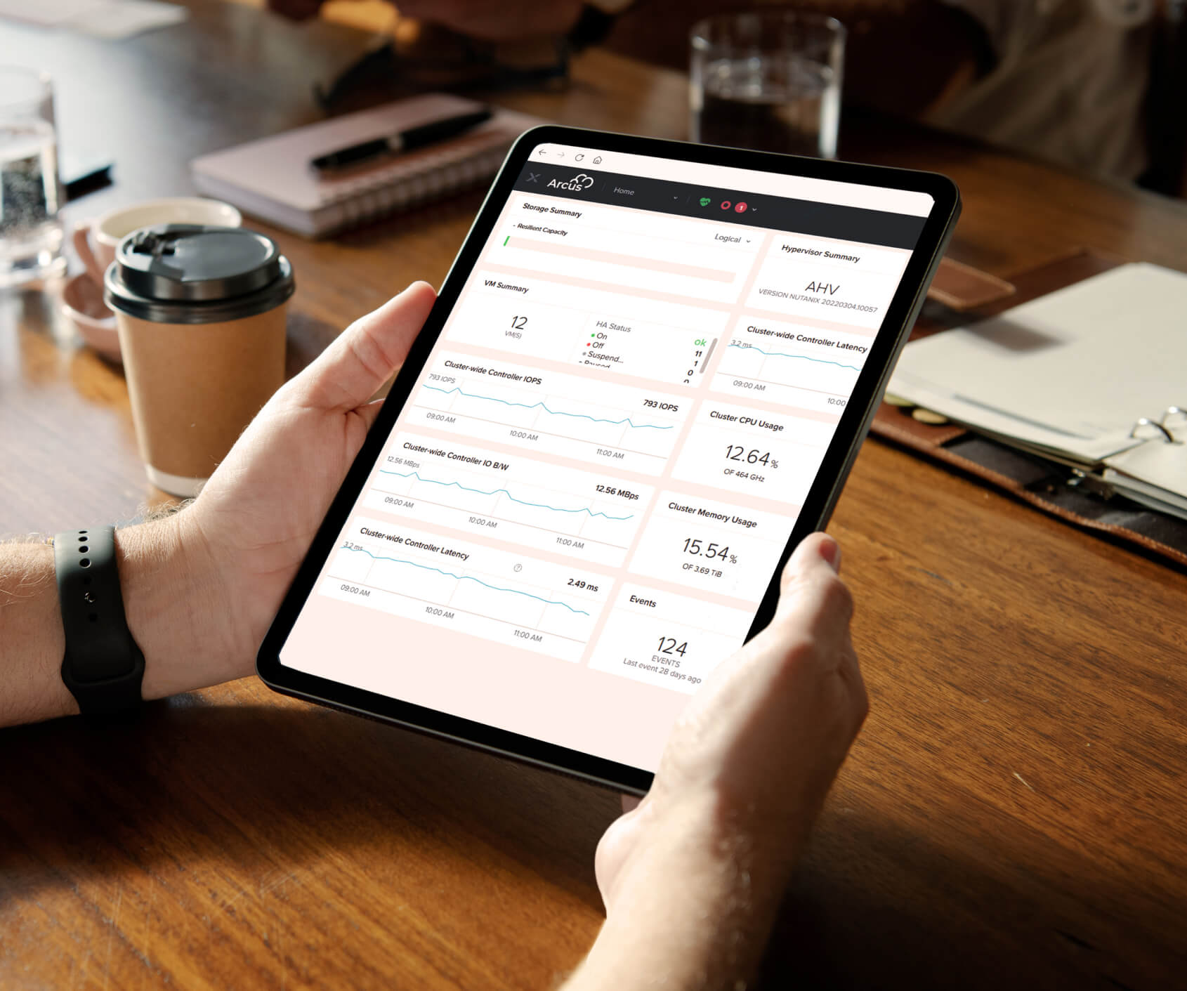 Photo of someone using a tablet with Arcus app on the screen